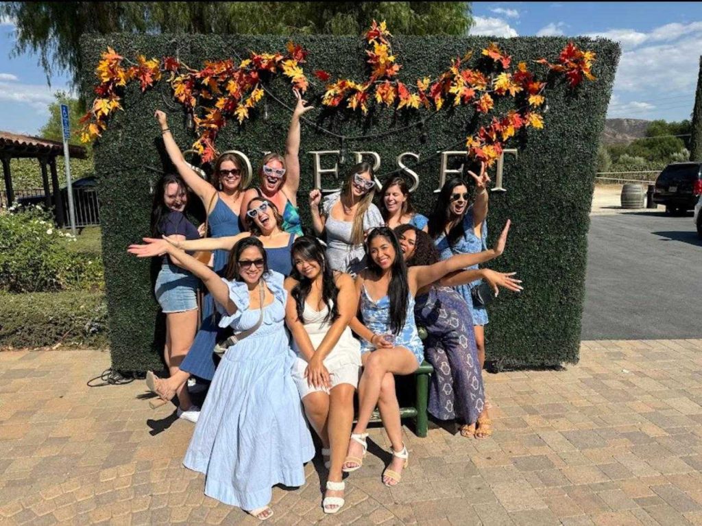 girls in wine tour, temecula wine tours, girls in a photoshoot wall